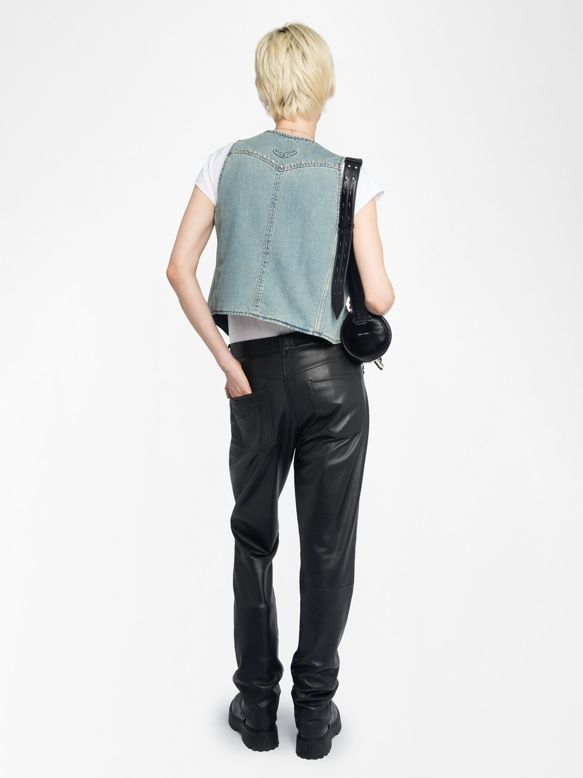 Gillier Denim Vest - This sleeveless denim vest is punctuated with silver studs and a raw edge finish—distressed just right. Layer it over everything, wear it like armor. Bold, free, undeniably Zadig.